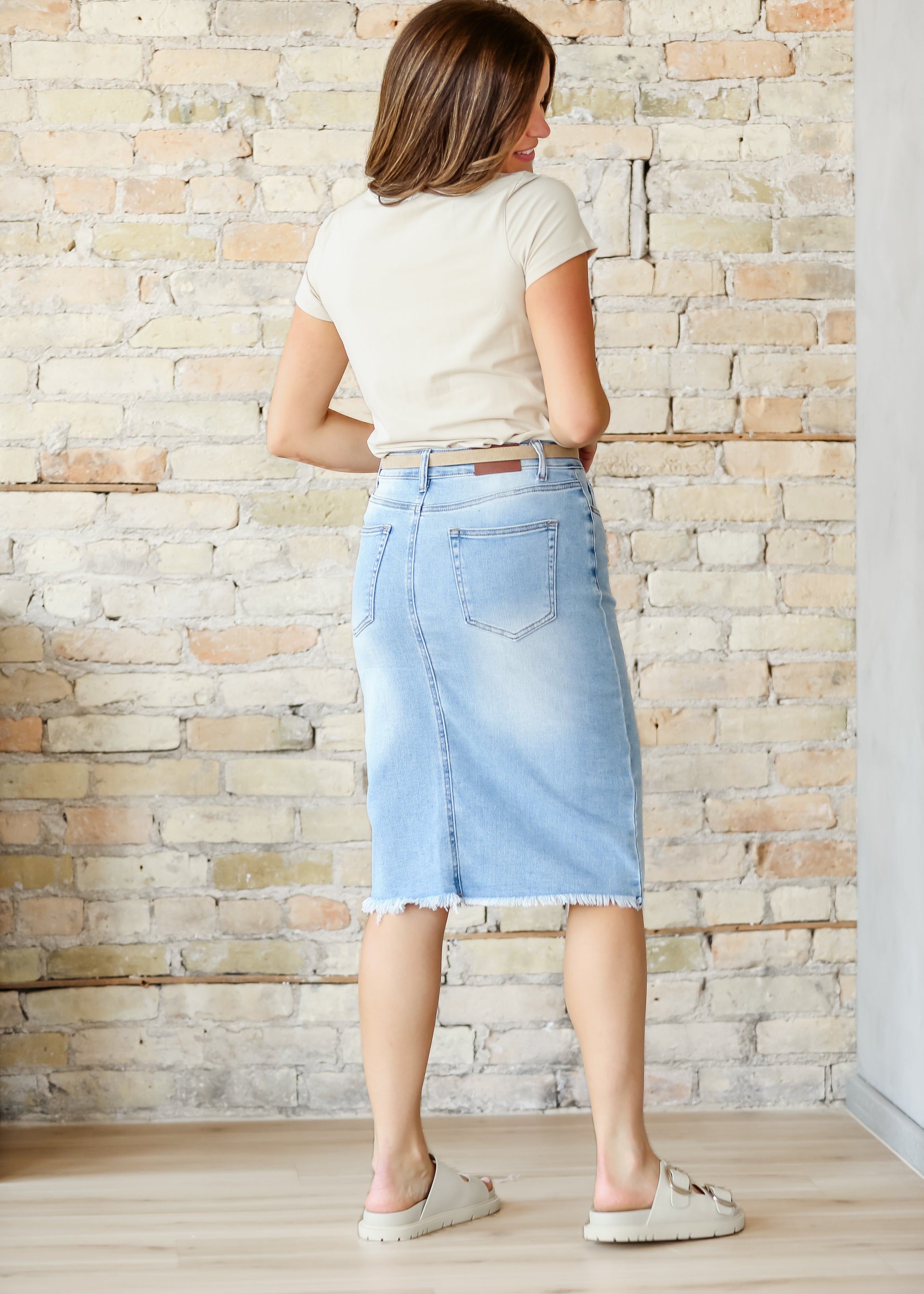 Inherit Co. Drew Raw Hem Midi Denim Skirt — in-use photo