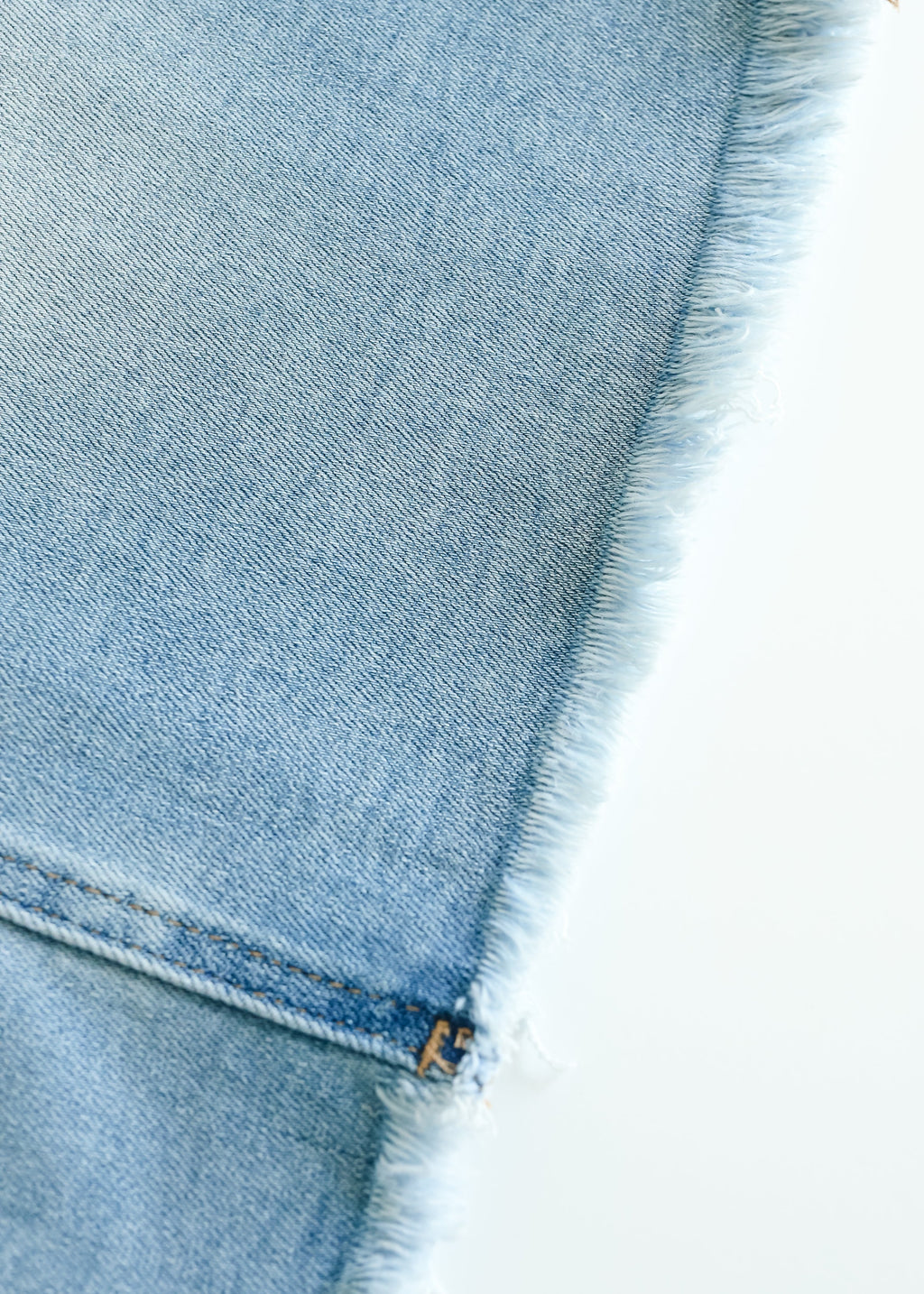 Inherit Co. Drew Raw Hem Midi Denim Skirt — detail close-up