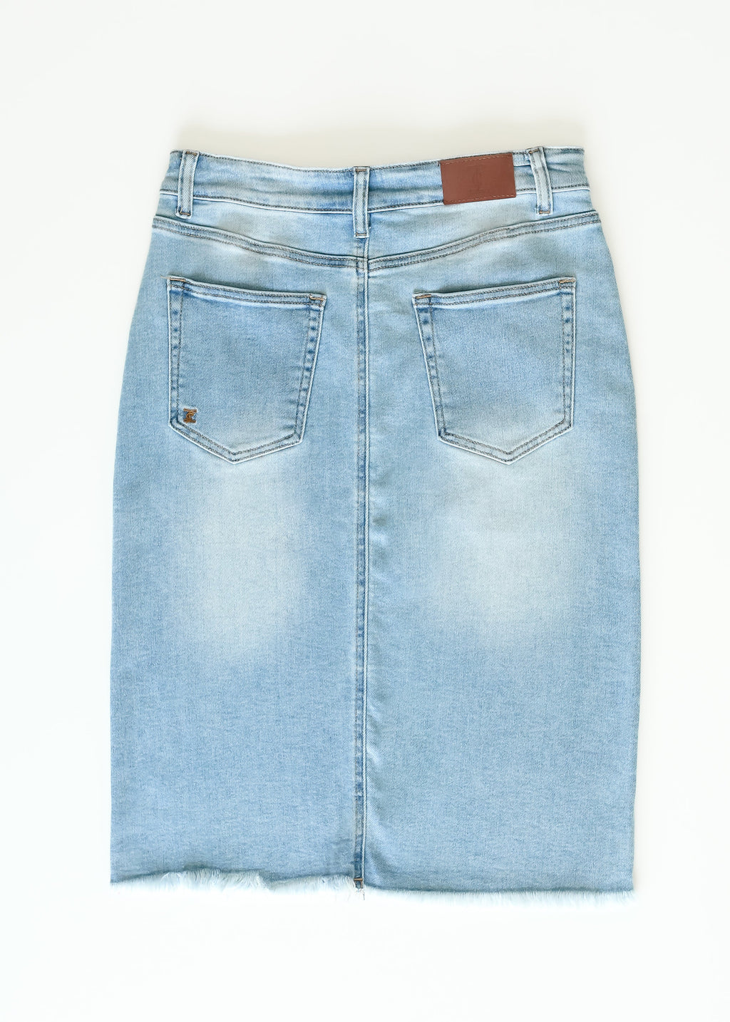 Inherit Co. Drew Raw Hem Midi Denim Skirt — flat-lay composition