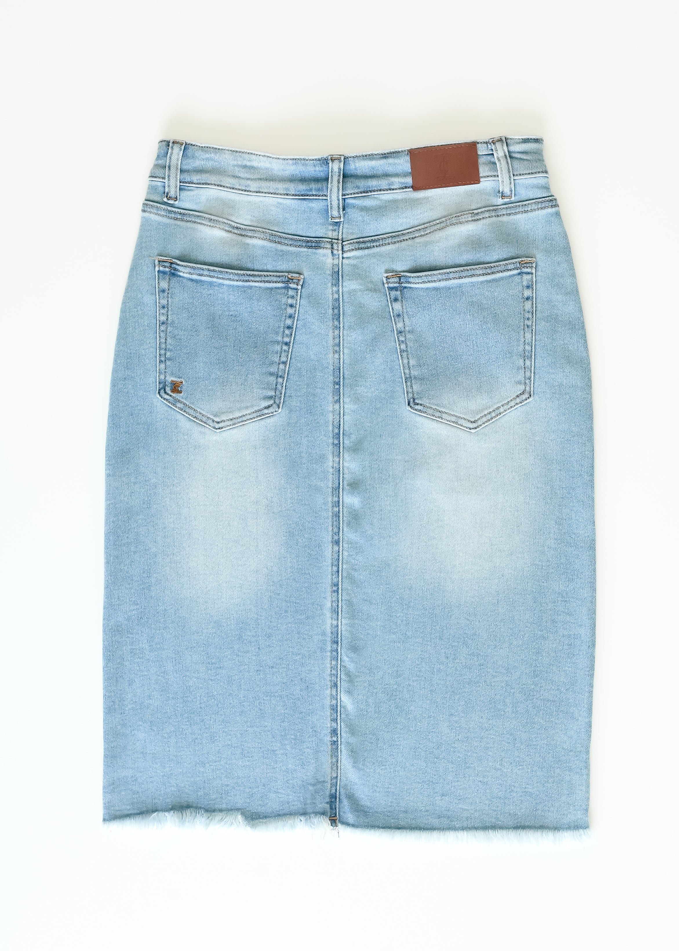 Inherit Co. Drew Raw Hem Midi Denim Skirt — flat-lay composition