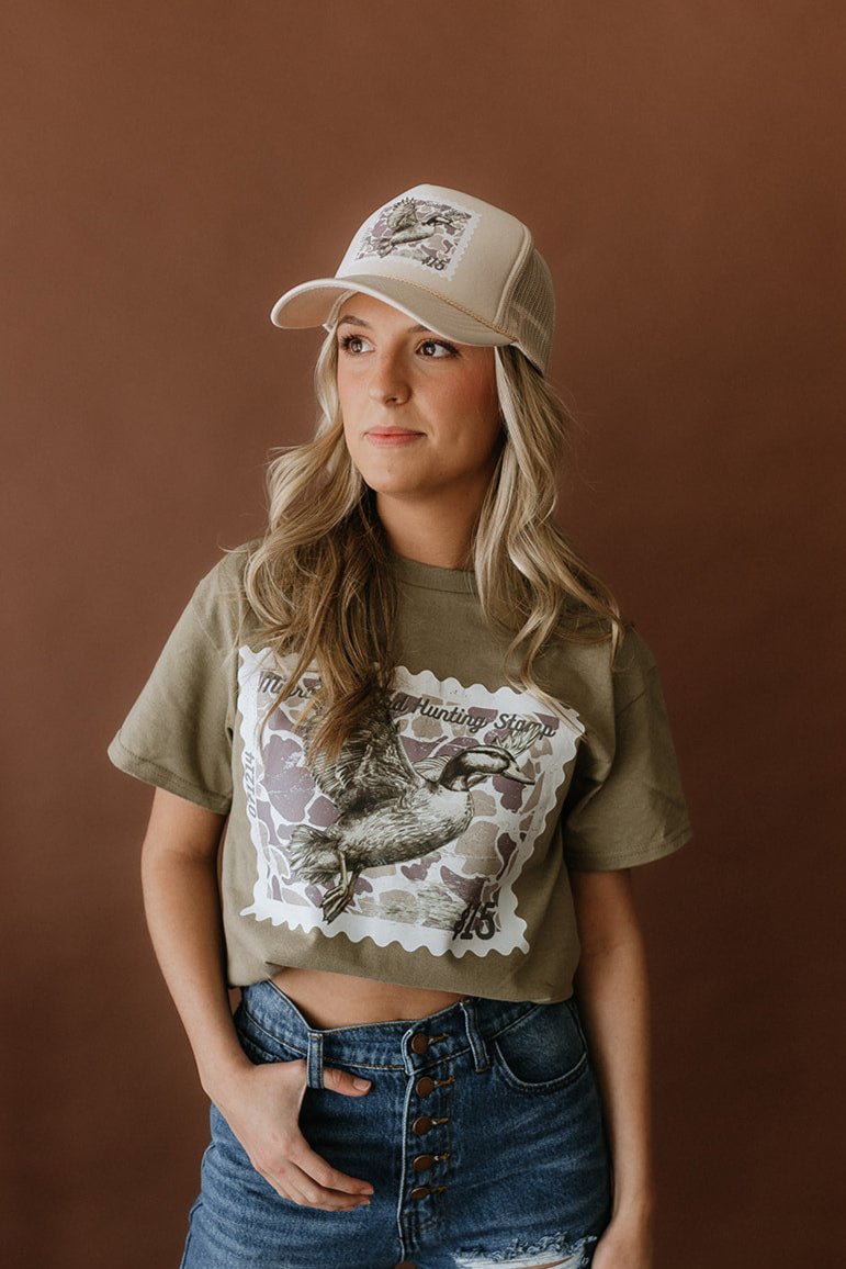 Wild Junkie Duck Stamp Trucker Hat — lifestyle context