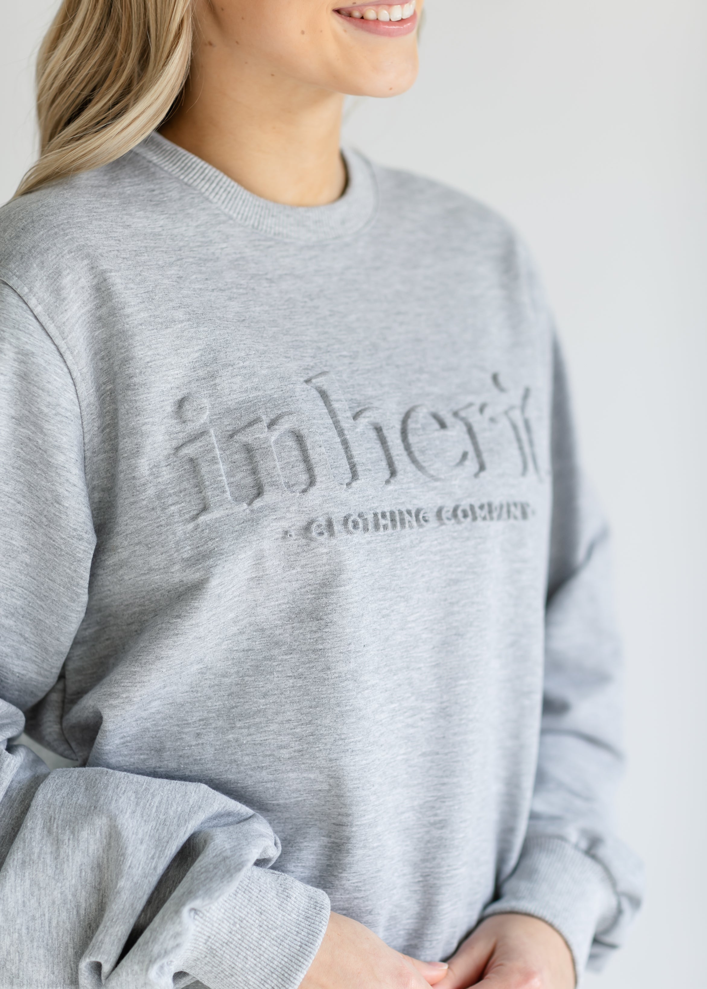Inherit Co. Embossed Inherit Logo Crewneck Sweatshirt — in-use photo