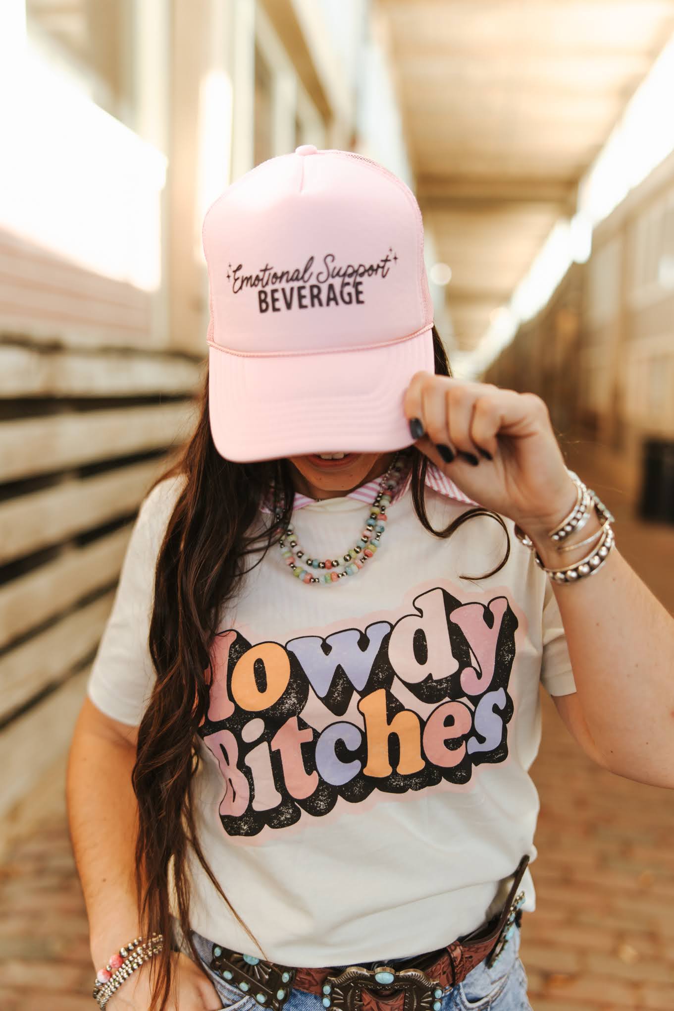 Wild Junkie Emotional Support Beverage Pink Trucker Hat — Wild Junkie branding close-up