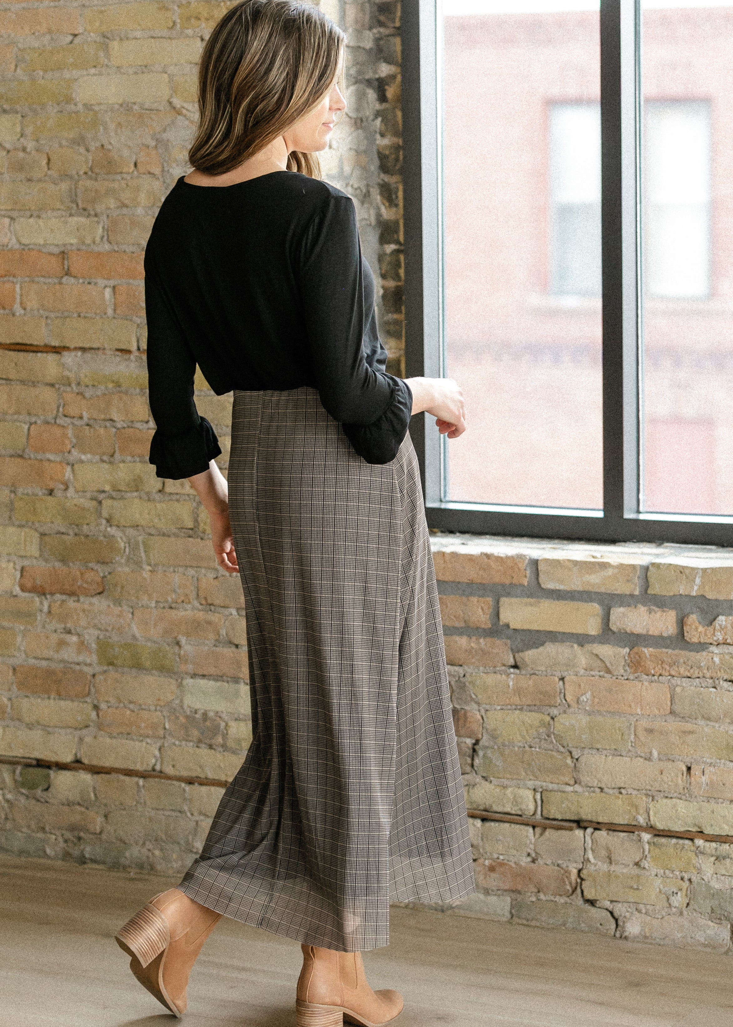 Inherit Co. Essential Black Ruffled 3/4 Sleeve Top — lifestyle context