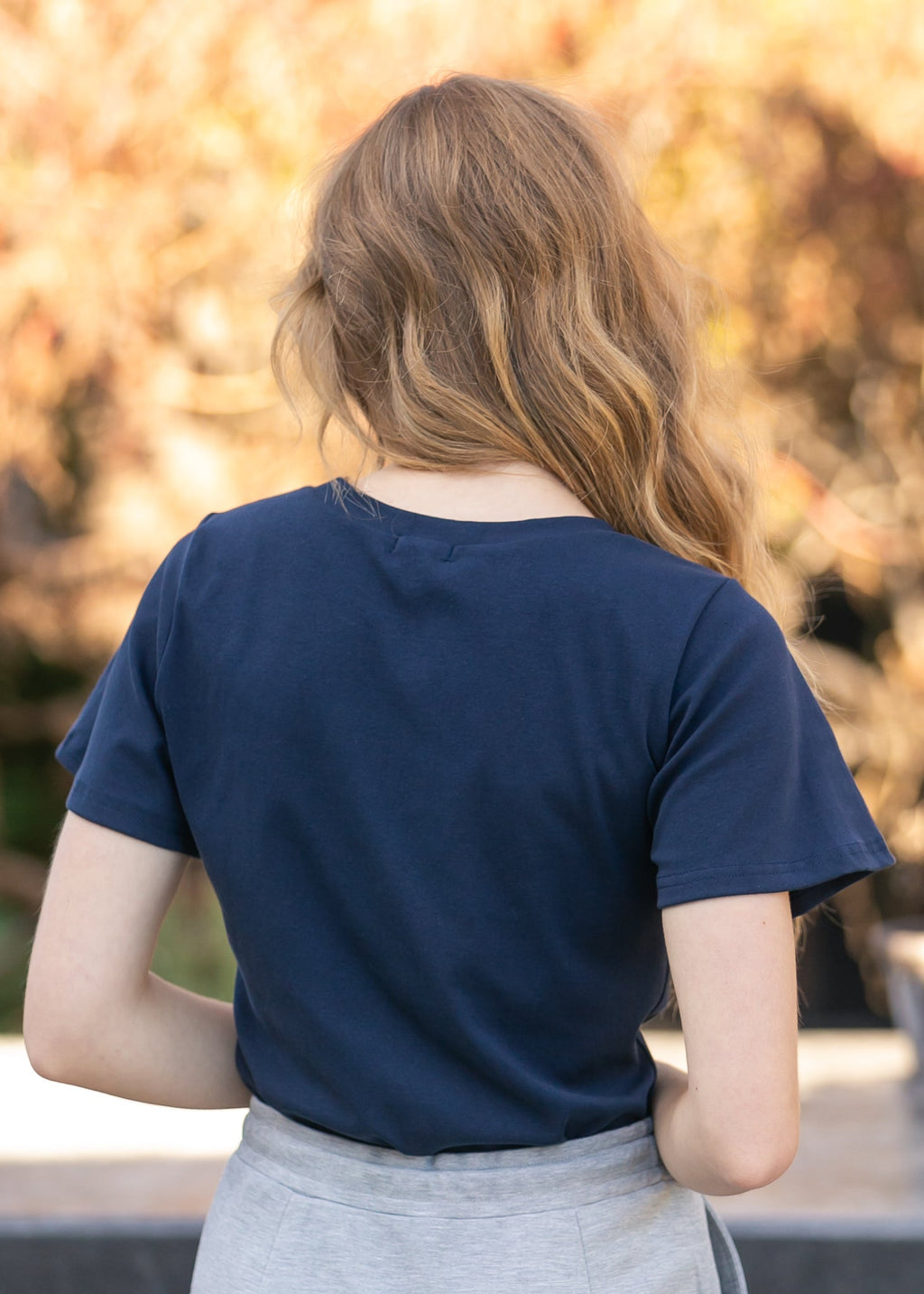 Inherit Co. Essential Navy Flutter Sleeve Top — product on model