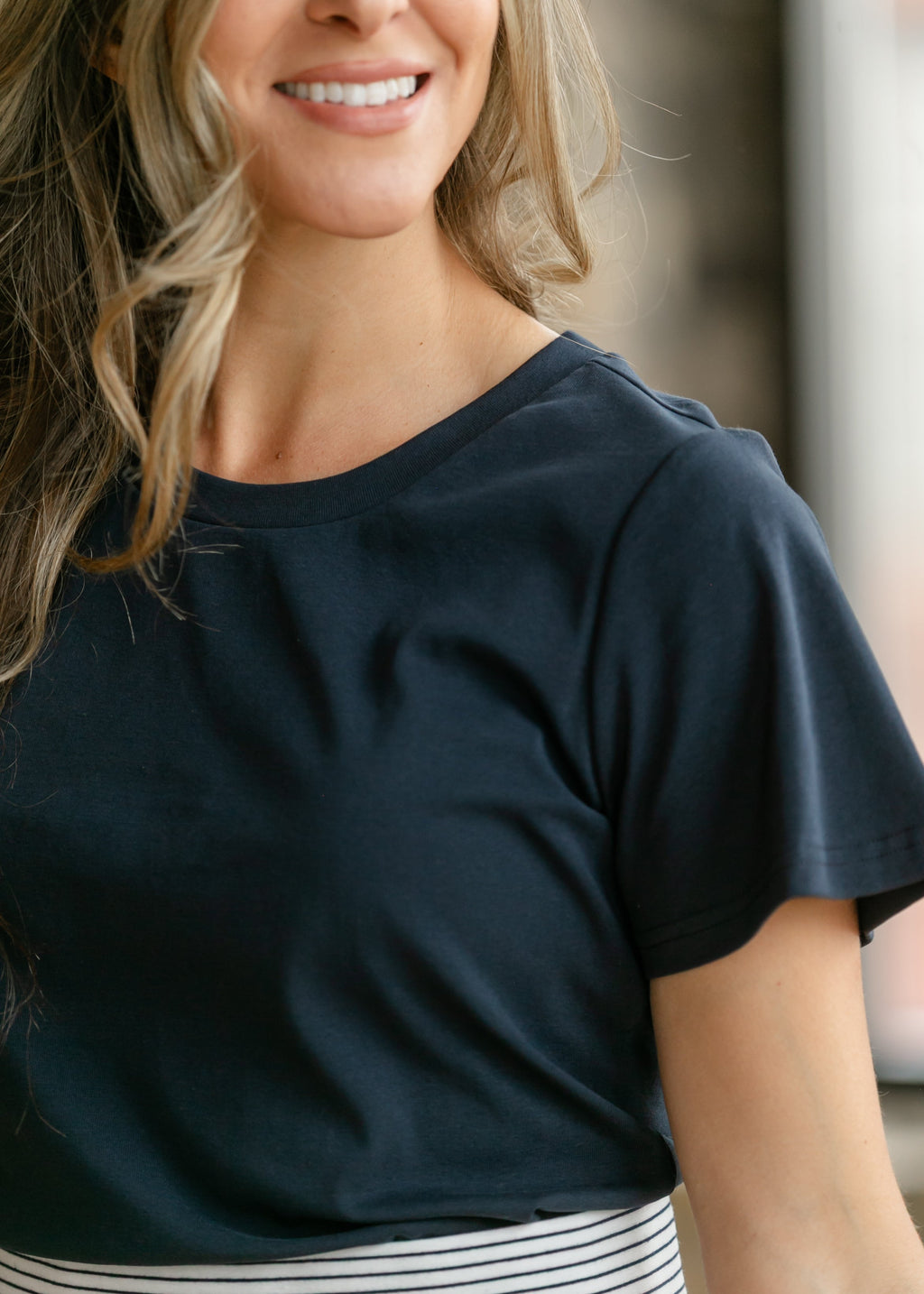 Inherit Co. Essential Navy Flutter Sleeve Top — lifestyle context