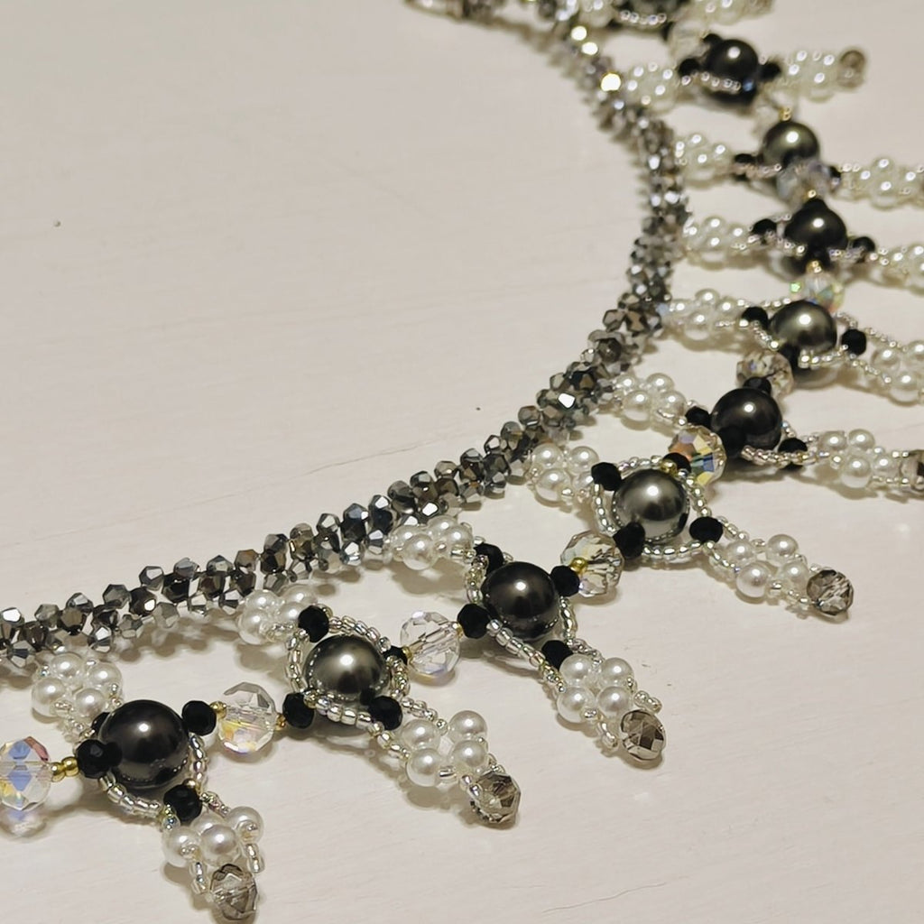 Mariam's Collection Handmade Woven Beaded Necklace | Glass Beads & Shell Pearls Choker | Intricate Seed Bead Art Necklace (MAC343) — Mariam's Collection branding close-up