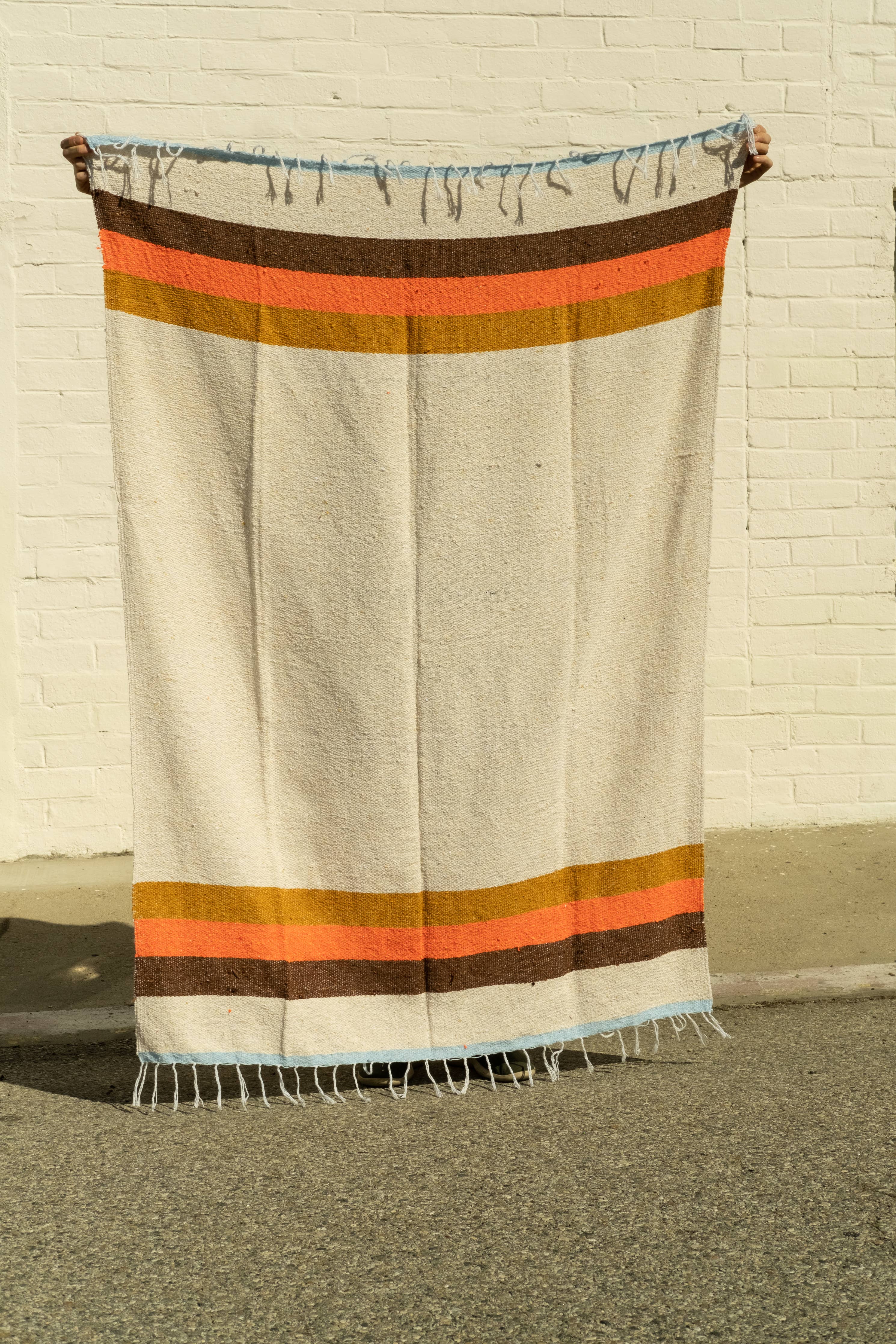 WONENA Sundream 70s - Sustainable Recycled Throw Blanket — WONENA branding close-up