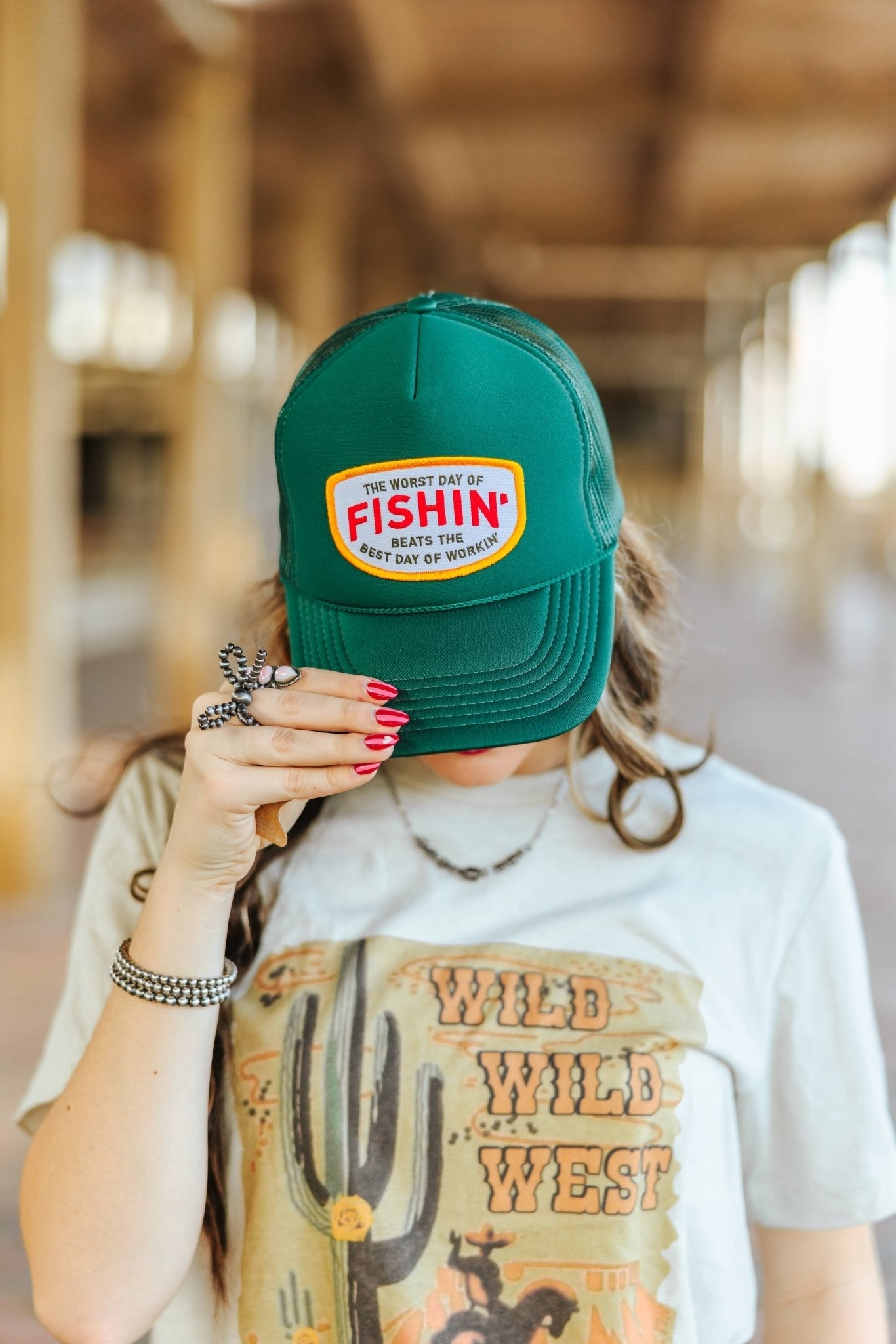 Wild Junkie Fishin' Beats Workin' Patch Trucker Hat — lifestyle context