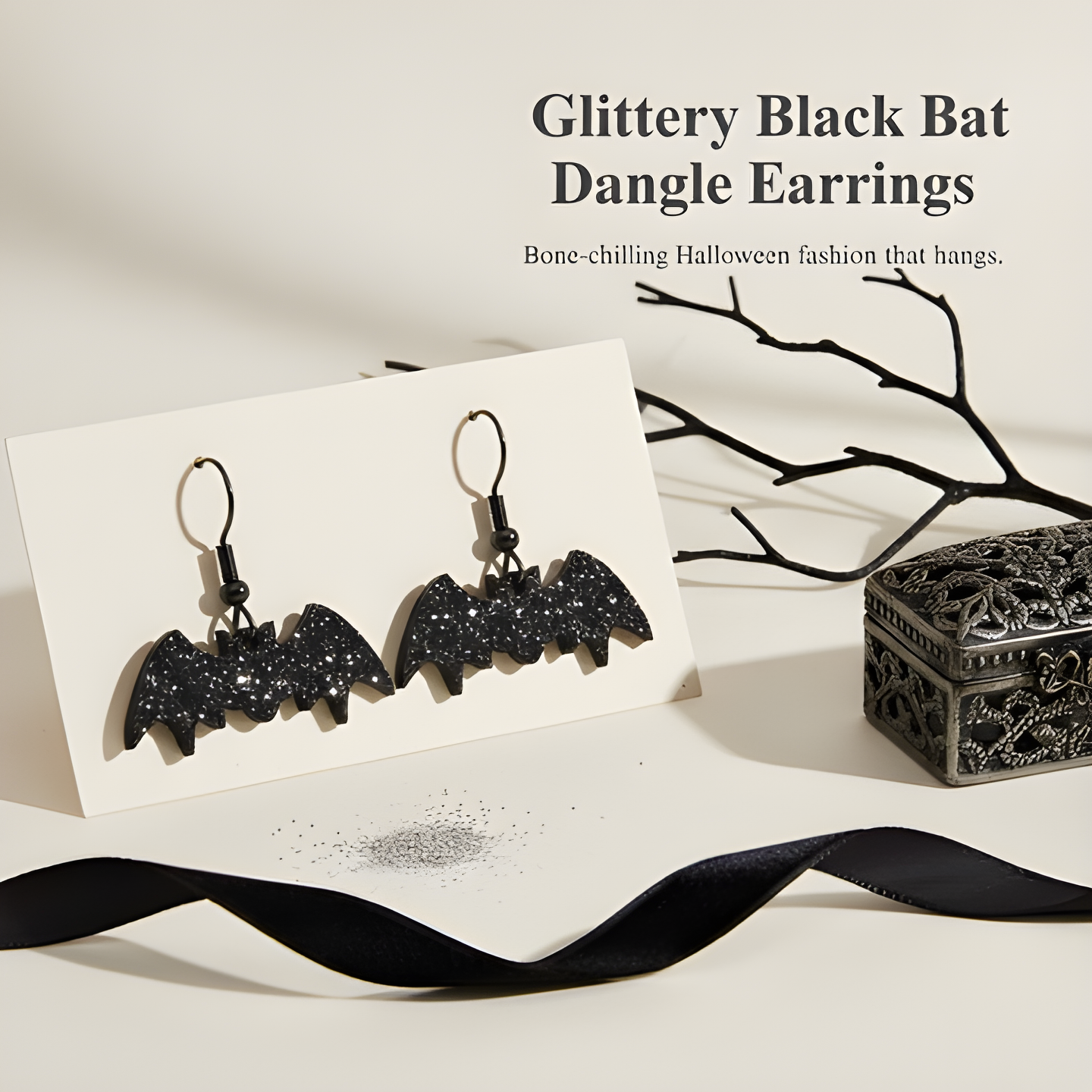 BodyCandy Glittery Black Bat Dangle Earrings — detail close-up