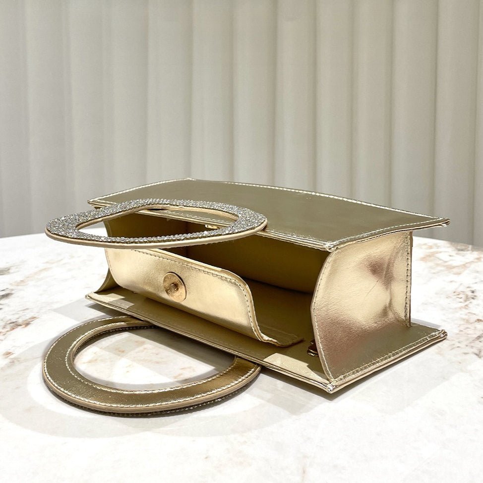 Mariam's Collection Gold Reflective Evening Clutch with Diamond-Studded Circular Handle (MAC294) — Mariam's Collection branding close-up