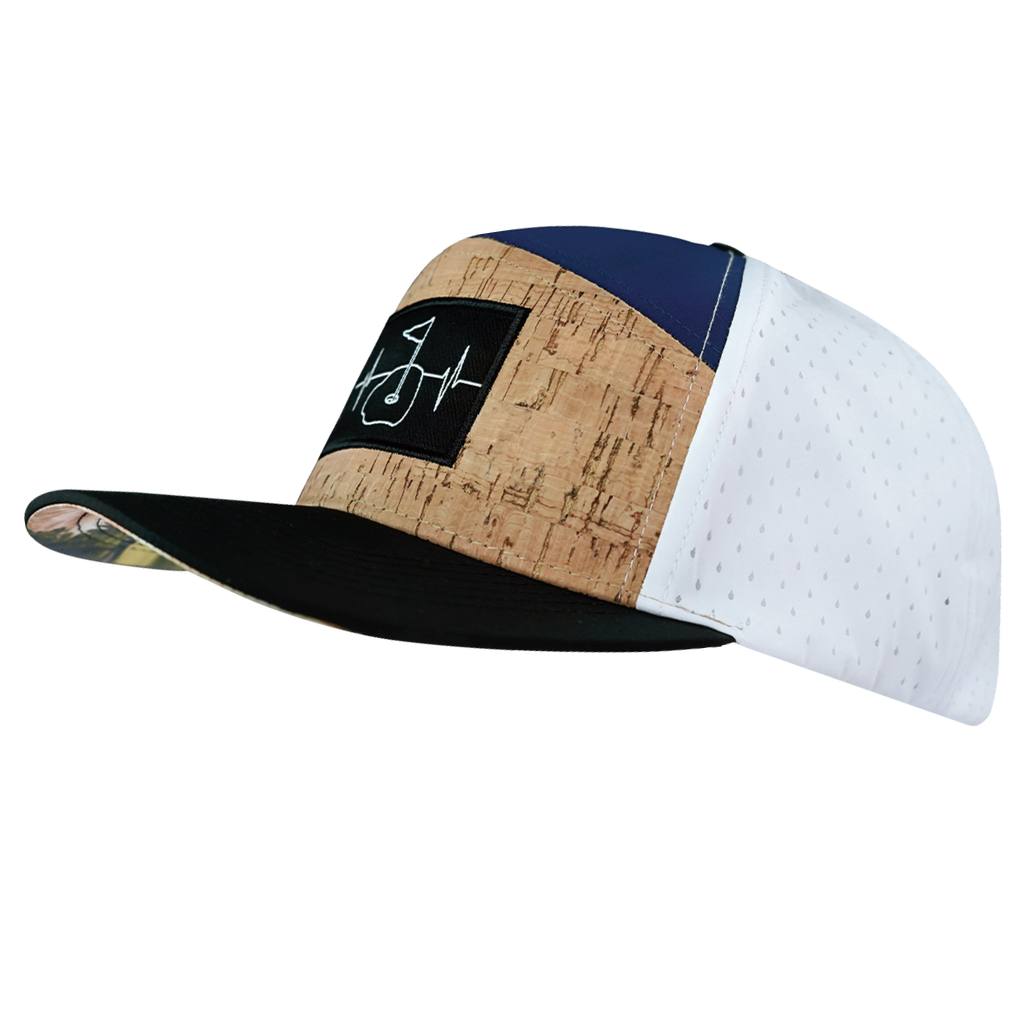 The Heartbeat Brand Golf Hat - Flat Bill - Cork - Black / Navy / White - Laser Mesh — The Heartbeat Brand branding close-up