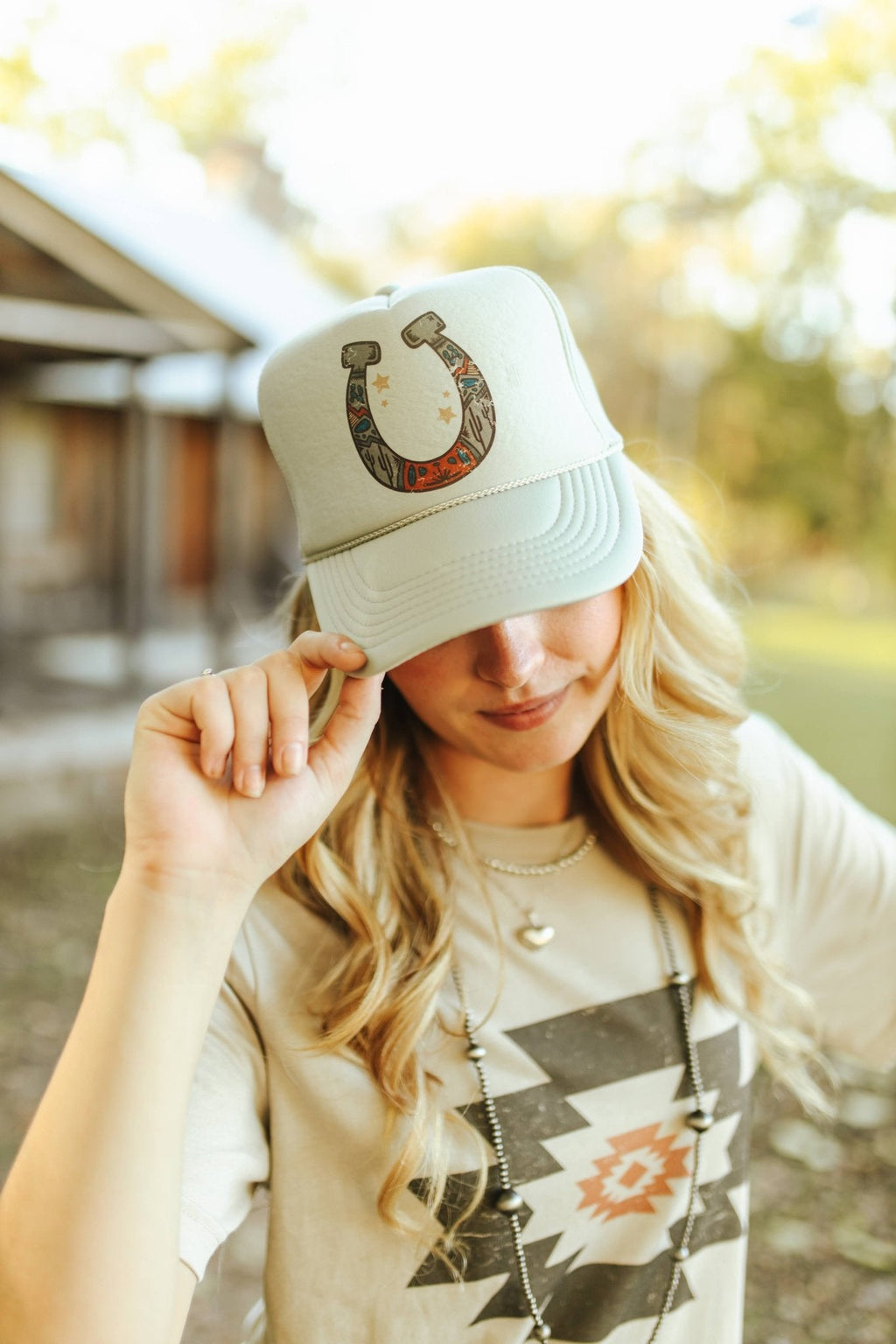 Wild Junkie Horse Shoe Trucker Hat — detail close-up