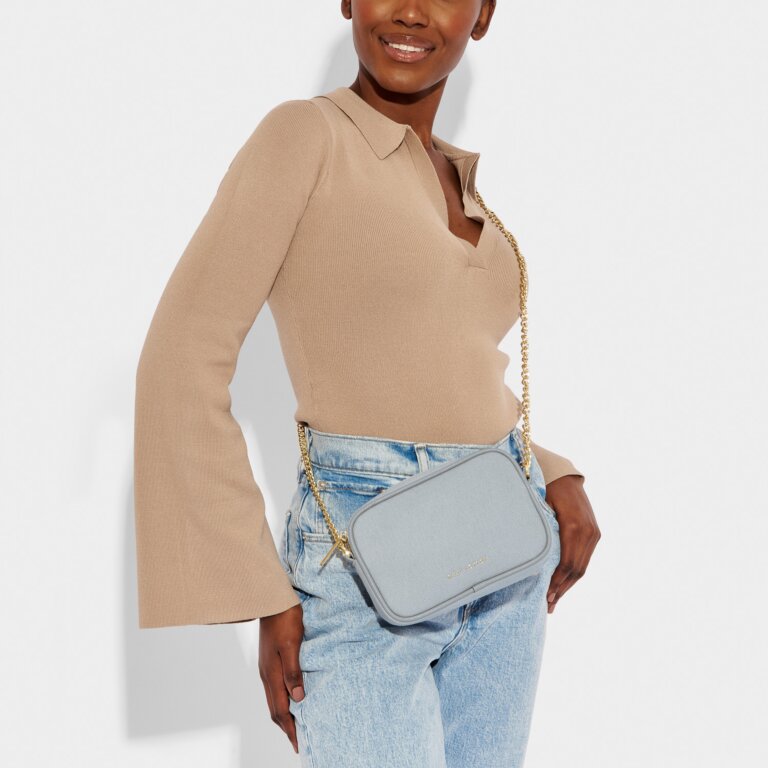 KADOU BOUTIQUE Amalfi Canvas Crossbody Bag — lifestyle context
