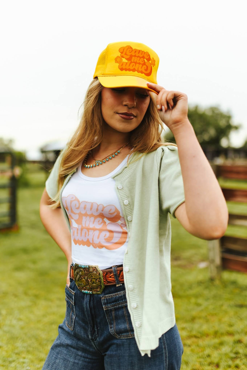 Wild Junkie Leave Me Alone Retro Flower Trucker Hat — Wild Junkie branding close-up