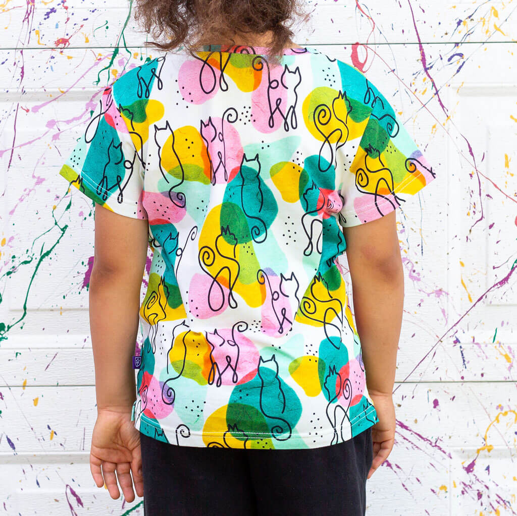 Princess Awesome & Boy Wonder "Purr-casso" Art Cats Henley Short Sleeve Tee — Princess Awesome & Boy Wonder branding close-up