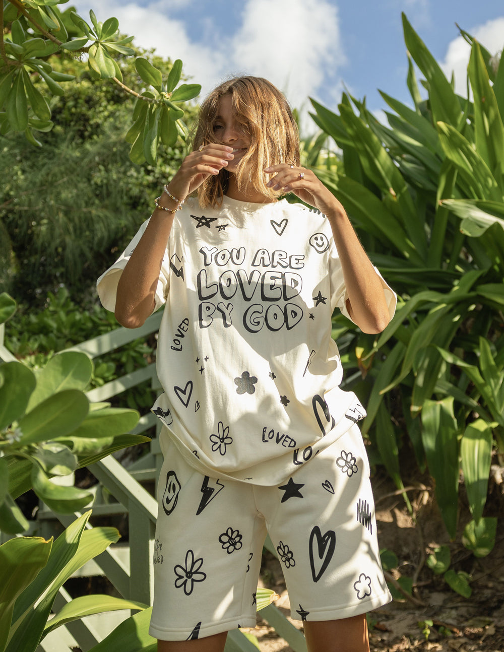 Elevated Faith Loved By God All-Over Cream Unisex Short — lifestyle context