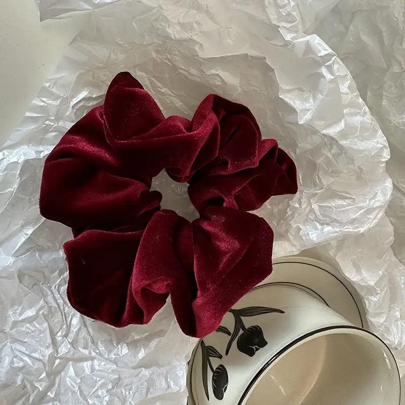 Mariam's Collection MAC009 hijab scrunchies, velvet flower hair accessories — Mariam's Collection branding close-up