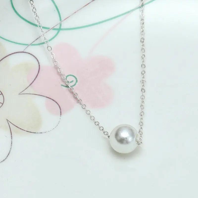 Mariam's Collection Mariam's Collection MAC042 freshwater pearl clavicle chain — Mariam's Collection branding close-up
