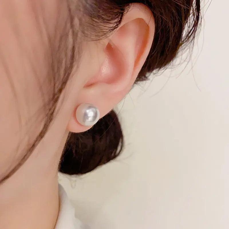 Mariam's Collection Mariam's Collection MAC055 Natural Freshwater Pearl Stud Earrings — Mariam's Collection branding close-up