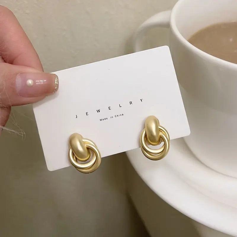 Mariam's Collection Mariam's Collection MAC064 Interlocking Circle Earrings — lifestyle worn / used context