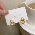 Mariam's Collection Mariam's Collection MAC064 Interlocking Circle Earrings — lifestyle worn / used context