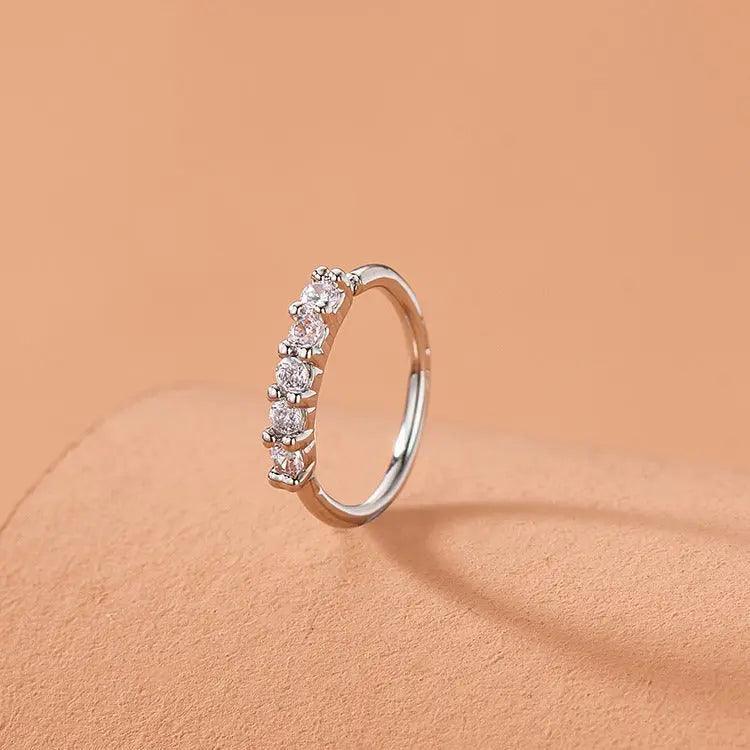 Mariam's Collection Mariam's Collection MAC066 Minimalist Openable Helix Hoop Nose Ring — Mariam's Collection branding close-up