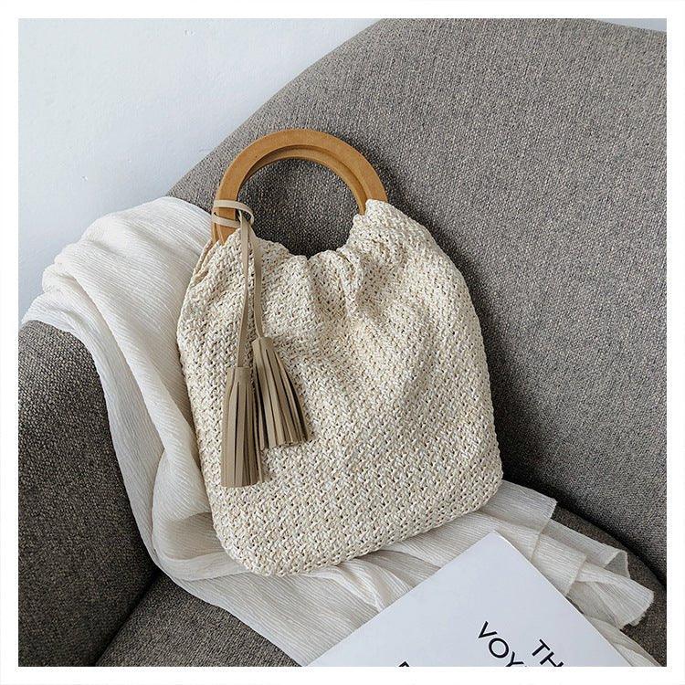 Mariam's Collection MAC132 Fashionable Straw Simple Beach Tassel Bucket Bag — Mariam's Collection branding close-up