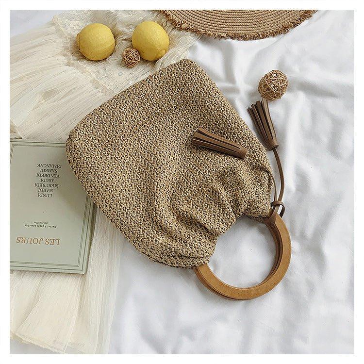 Mariam's Collection MAC132 Fashionable Straw Simple Beach Tassel Bucket Bag — lifestyle worn / used context