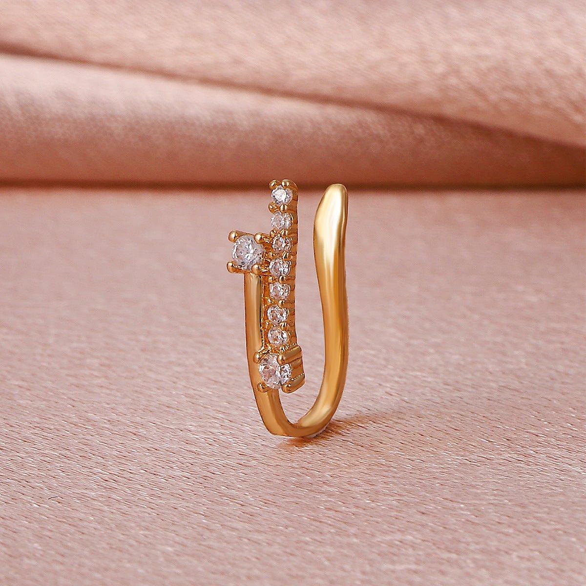 Mariam's Collection MAC134  Non-Puncture T-Shape Micropaved Zirconia Nose Ring — Mariam's Collection branding close-up