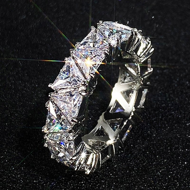 Mariam's Collection MAC161 Full-Circle Single-Row Triangular Zircon Ring — Mariam's Collection branding close-up