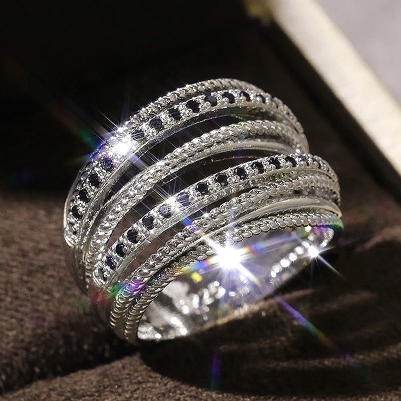 Mariam's Collection Mariam's Collection Crossed Zirconia Ring(MAC192) — Mariam's Collection branding close-up