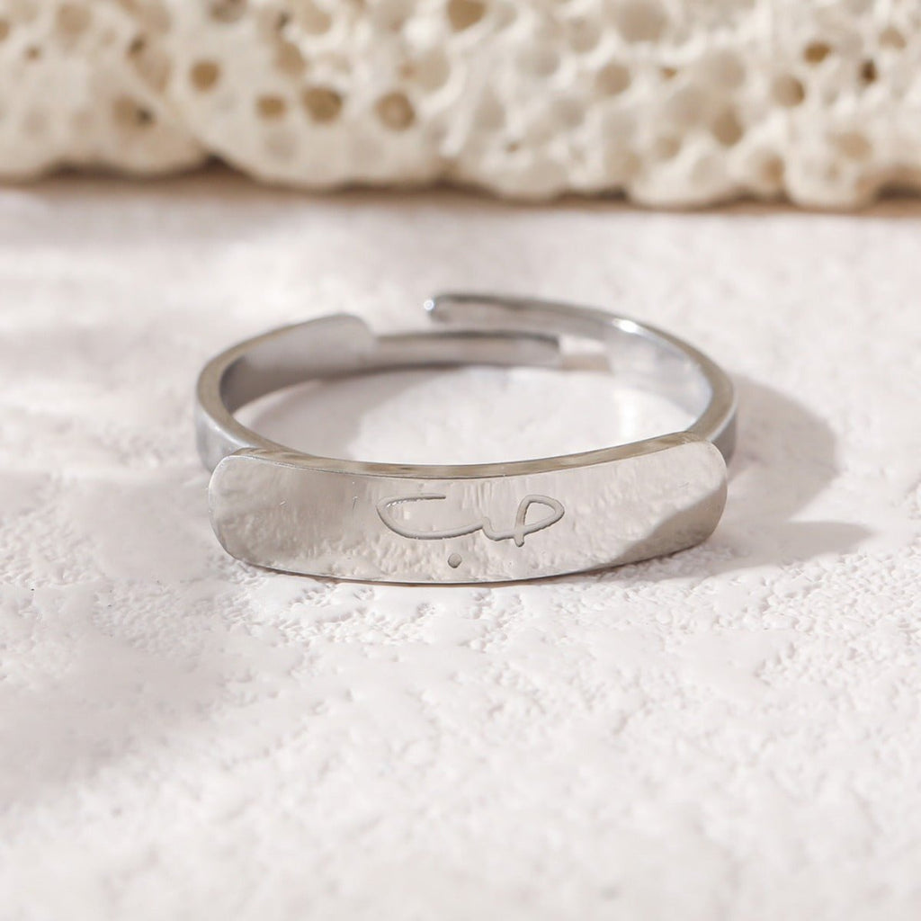 Mariam's Collection Simple engraved titanium steel ring with Arabic elements （With gift box）(MAC215) — Mariam's Collection branding close-up