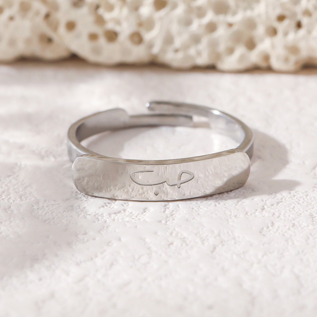 Mariam's Collection Simple engraved titanium steel ring with Arabic elements （With gift box）(MAC215) — Mariam's Collection branding close-up