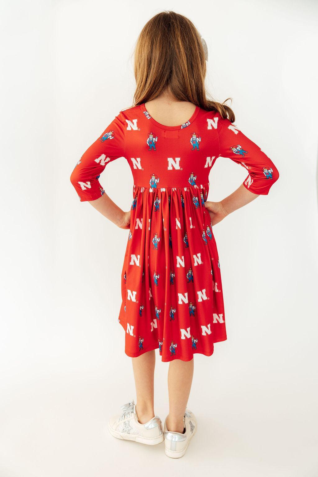 Mila & Rose ® Nebraska Red Herbie Husker 3/4 Sleeve Pocket Twirl Dress — lifestyle context
