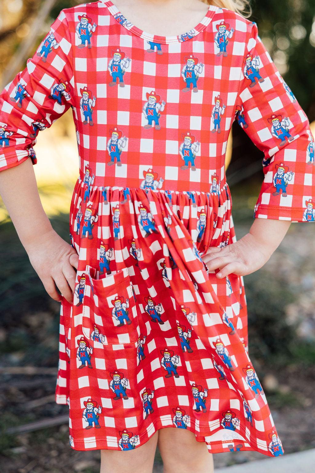 Mila & Rose ® Nebraska Plaid Herbie Husker 3/4 Sleeve Pocket Twirl Dress — lifestyle context