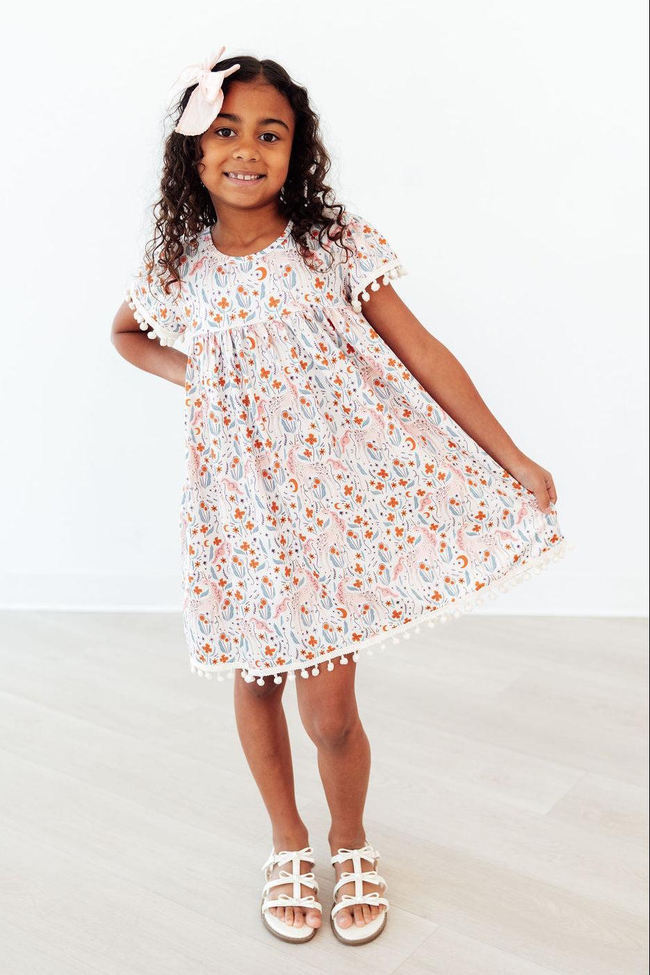 Mila & Rose ® Unicorn Soiree Pom Pom Dress — lifestyle context