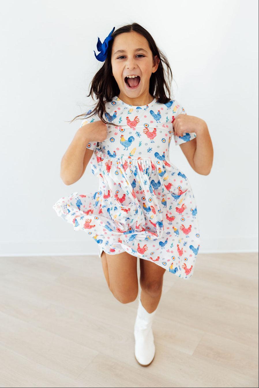Mila & Rose ® Rainbow Roosters S/S Pocket Twirl Dress — lifestyle context