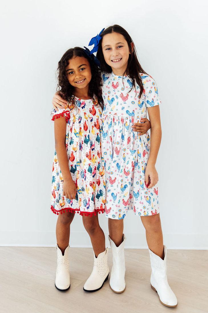 Mila & Rose ® Rooster Pom Pom Dress — packaging