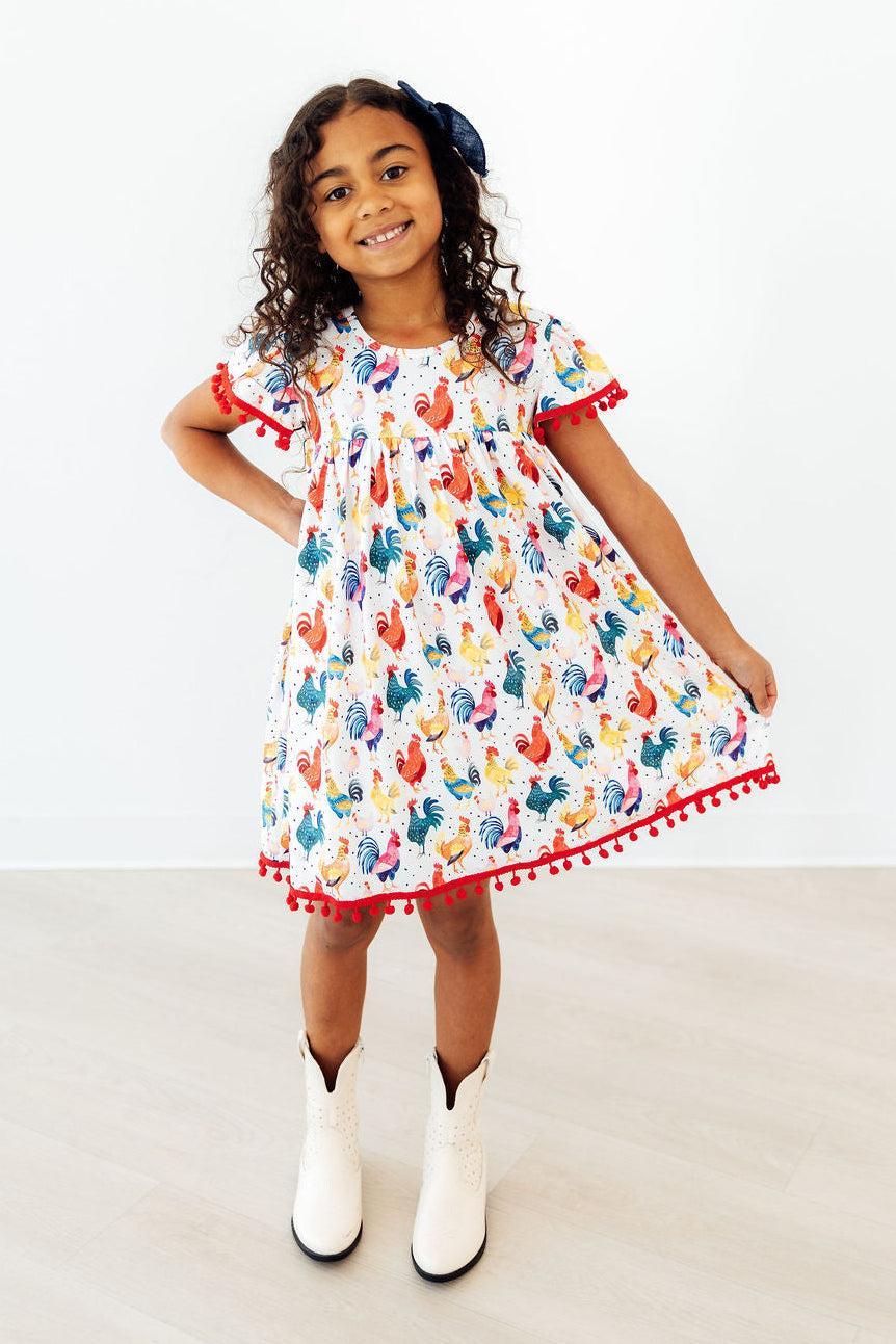 Mila & Rose ® Rooster Pom Pom Dress — detail close-up