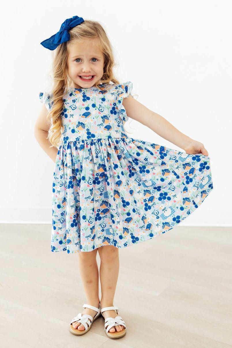 Mila & Rose ® Blueberry Picnic Flutter Sleeve Twirl Dress — lifestyle context