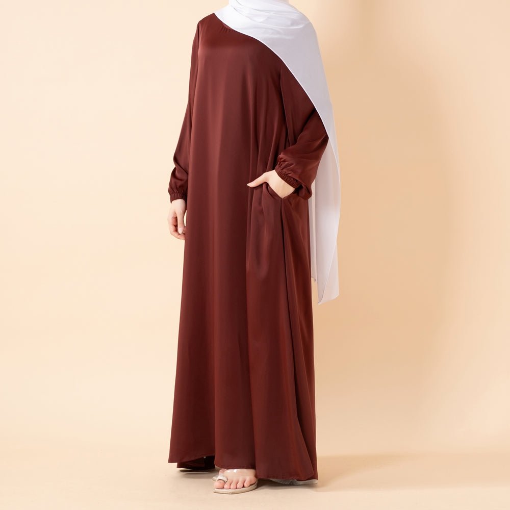 Mariam's Collection Modest Luxury Premium Satin Abaya | Umbrella Cut A-Line Abaya with Pockets (MA311) — flat-lay composition