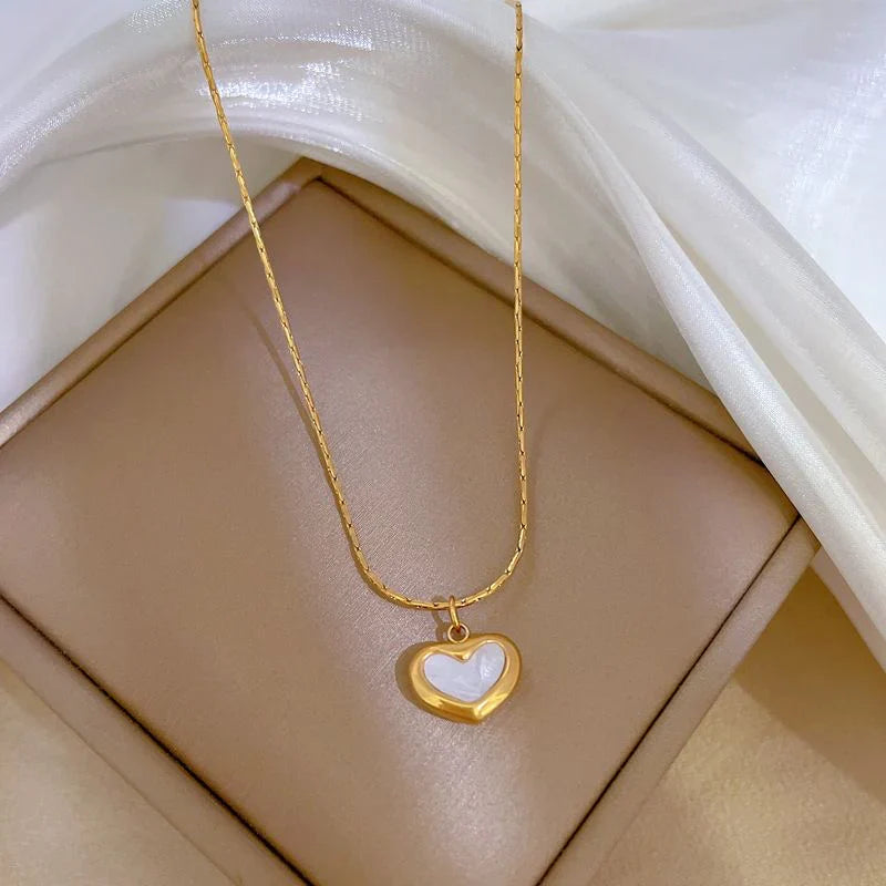 SORI STYLE Mother of Pearl Heart Pendant Necklace — detail close-up