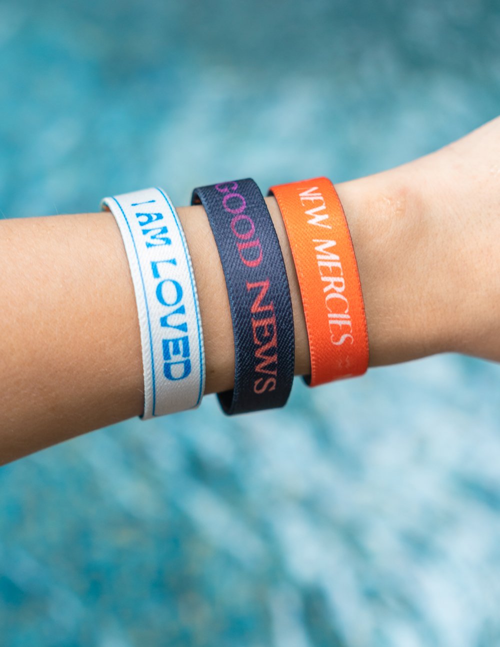 Elevated Faith Mystery Reversible Wristband — lifestyle context