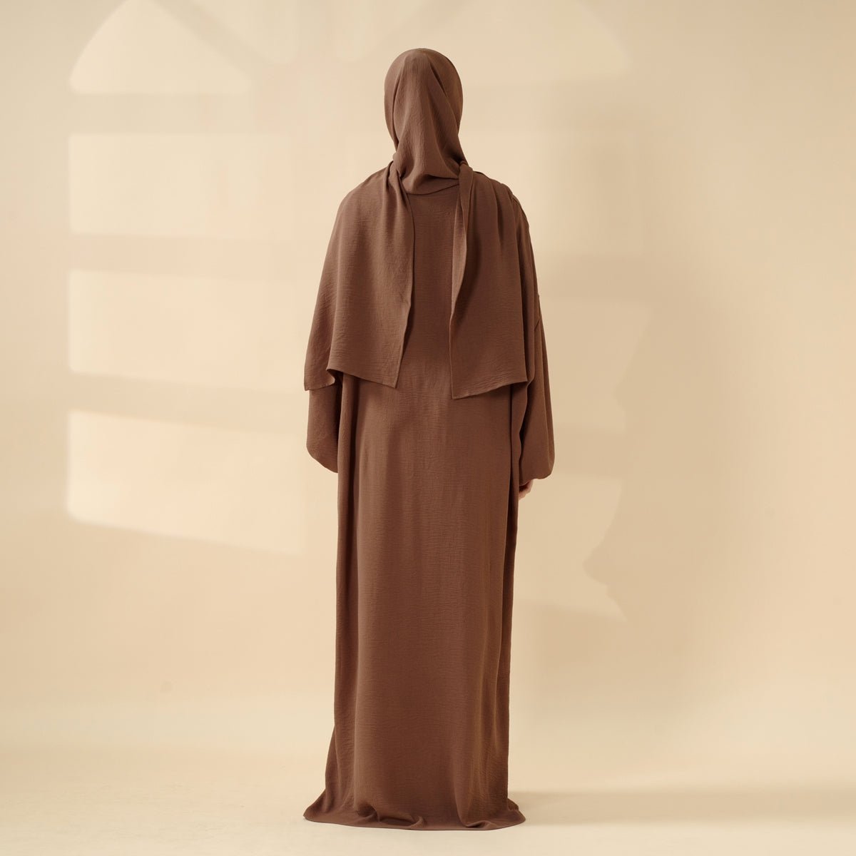 Mariam's Collection Cocoon-Cut Crepe Abaya Perfect For Umrah With One-Piece Hijab Attached (MA143) — lifestyle worn / used context