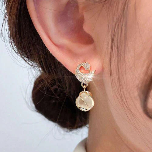 SORI STYLE Cozy Crystal Swan Drop Earrings — detail close-up