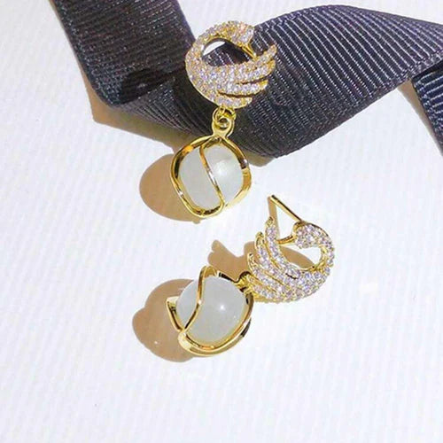 SORI STYLE Cozy Crystal Swan Drop Earrings — lifestyle context