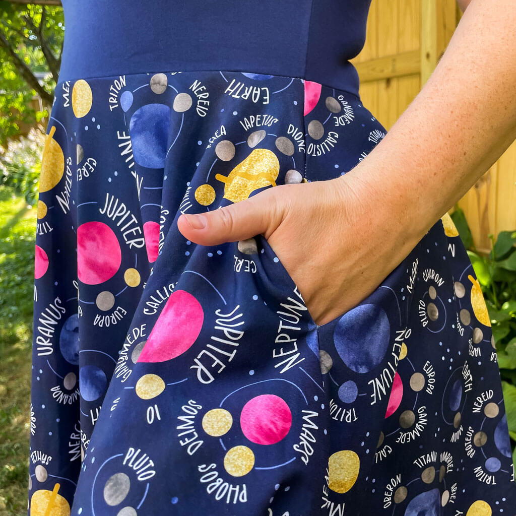 Princess Awesome & Boy Wonder Adult "Night Lights" Planets and Moons Super Twirler Dress with Pockets — lifestyle worn / used context
