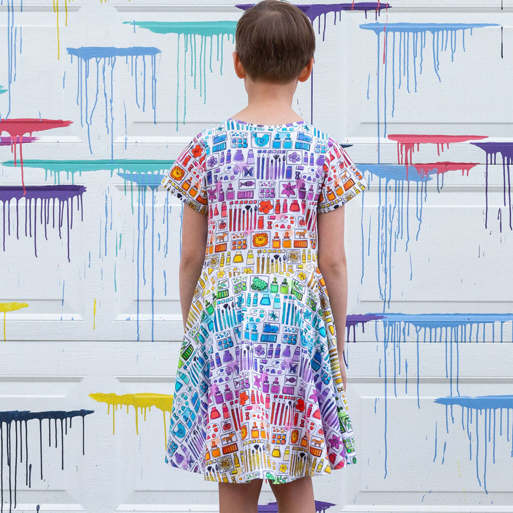 Princess Awesome & Boy Wonder "Smarty Paints" Rainbow Art Supplies Super Twirler Dress with Pockets — Princess Awesome & Boy Wonder branding close-up