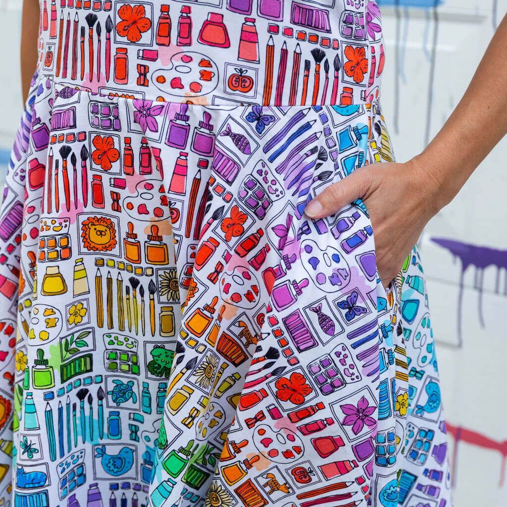 Princess Awesome & Boy Wonder Adult "Smarty Paints" Rainbow Art Supplies Super Twirler Dress with Pockets — Princess Awesome & Boy Wonder branding close-up